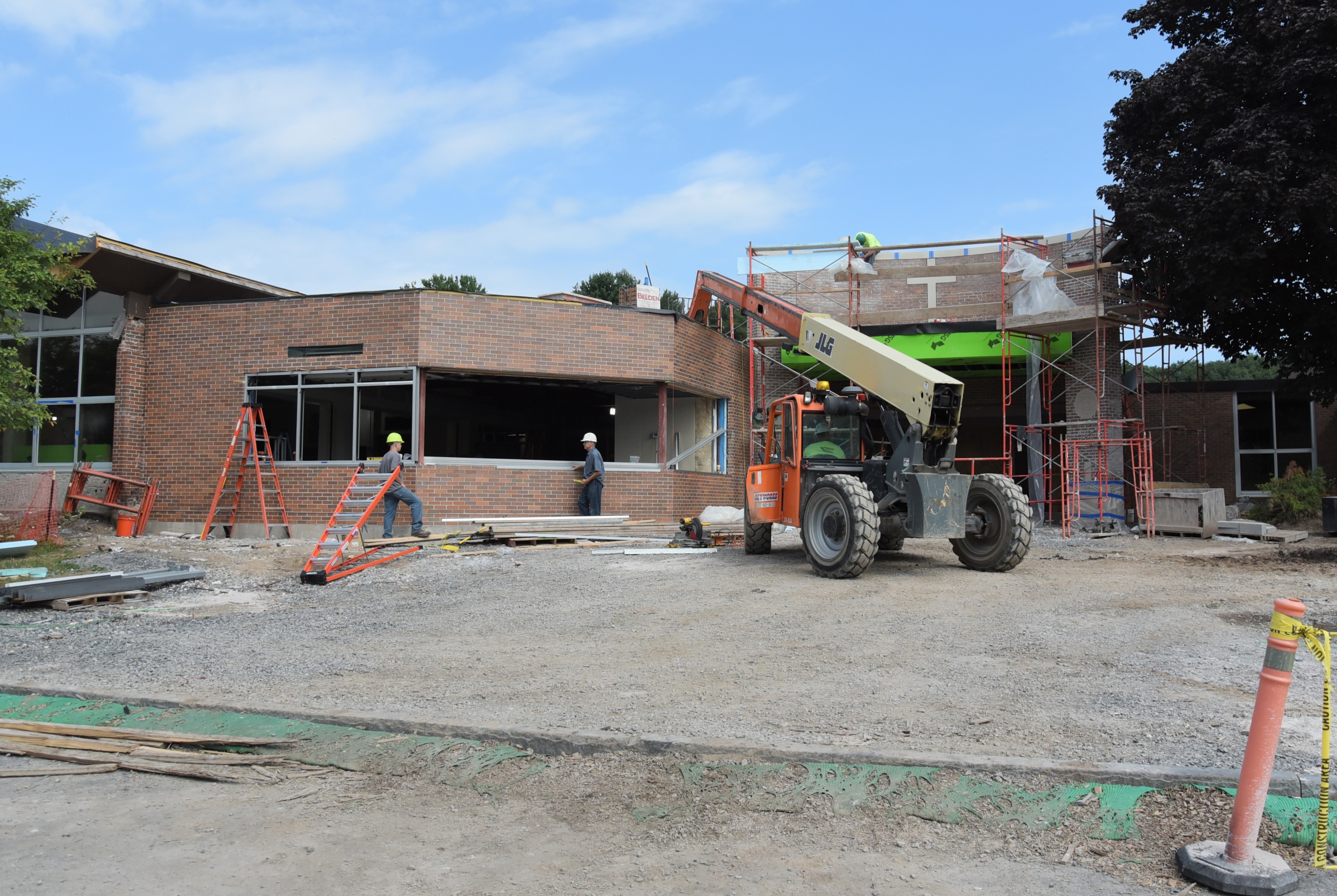 Front of school during construction (shot straight on far away)